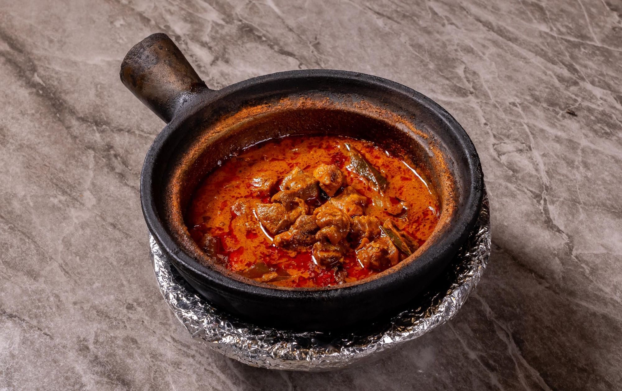 Mutton curry in a clay pot